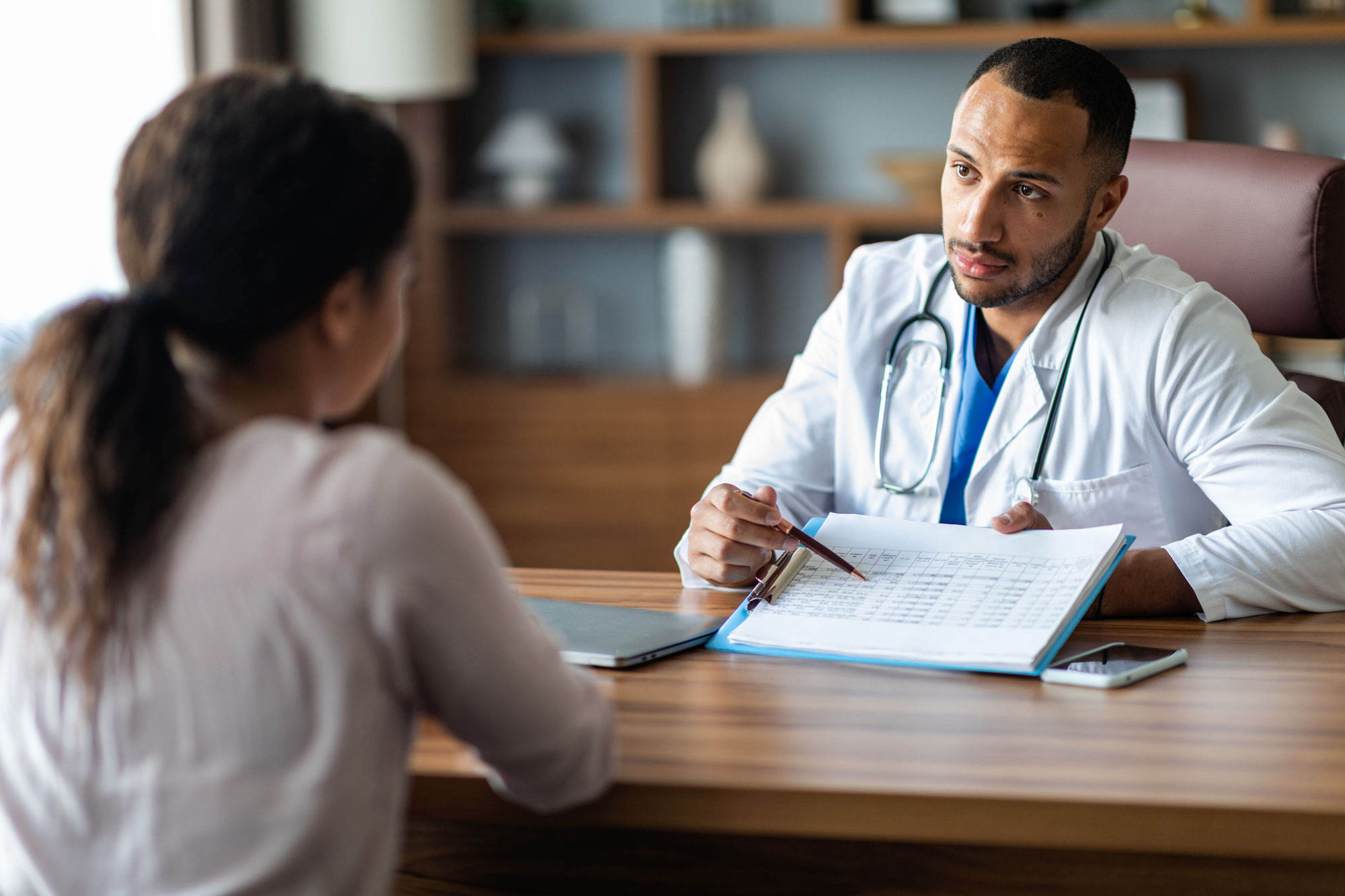 International doctor providing a patient with a treatment plan.